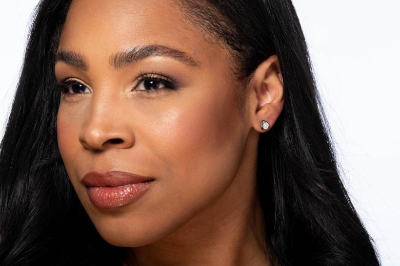 Woman wearing glacier fire earrings