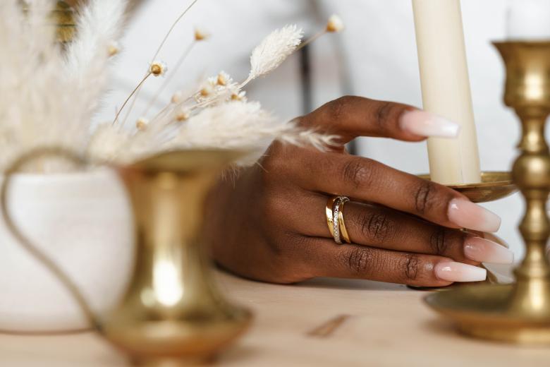 woman's hands display tuscany gold ring